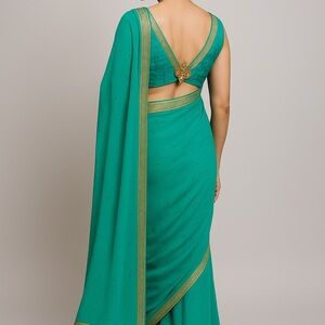 Stunning Turquoise Saree with Gold Border & Stone Work – NEW